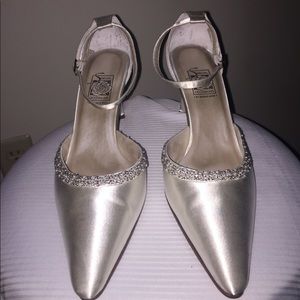 White satin shoes with pearl embellishments